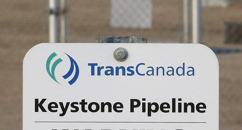 FILE- This Nov. 6, 2015, file photo shows a sign for TransCanada's Keystone pipeline facilities in Hardisty, Alberta, Canada. TransCanada Corp.’s Keystone pipeline leaked oil onto agricultural land in northeastern South Dakota, the company and state regulators said Thursday, Nov. 16, 2017, but state officials don’t believe the leak polluted any surface water bodies or drinking water systems. (Jeff McIntosh/The Canadian Press via AP, File)