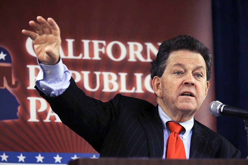 FILE - In this Friday, Oct. 4, 2013, file photo, economist Arthur Laffer, known as the "father of supply-side economics" and who was an economic advisor to President Ronald Reagan, speaks to an executive committee meeting of the California Republican Party at their convention in Anaheim, Calif. In their effort to overhaul the U.S. tax code, President Donald Trump and congressional Republicans are betting that by slashing taxes on corporations and rich people, the money diverted from the U.S. Treasury will find its way into the pockets of ordinary Americans. “It will increase real wages and it will increase them substantially,’’ says Laffer. (AP Photo/Reed Saxon, File)