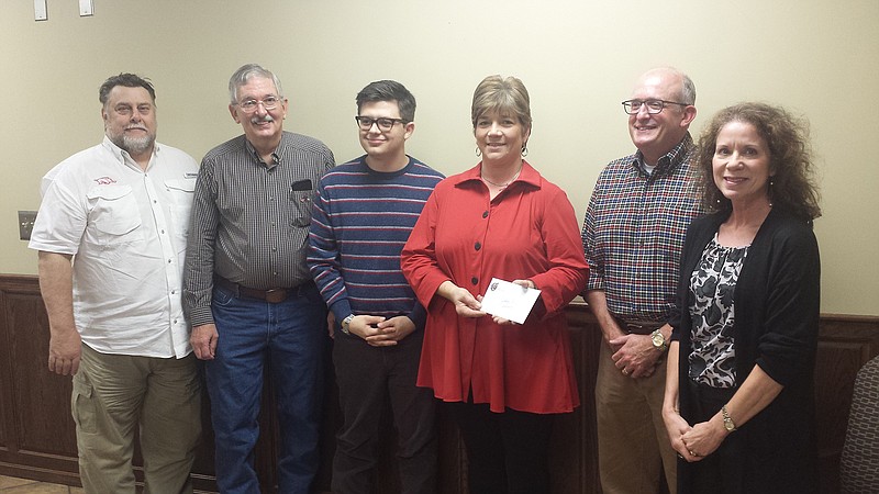 Johnny B's received a check for $2,000 from Main Street Texarkana for improvements to its restaurant. Pictured from left are Larry White, Dr. Charles Blankenship, Skylar Rogers, Sheila Crossland, Chad Trammel and Ina McDowell. (Submitted photo)
