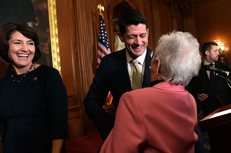House Speaker Paul Ryan of Wis., center, shares a laugh with Rep. Virginia Foxx, R-N.C., right, as Rep. Cathy McMorris Rodgers, R-Wash., left, watches following a news conference after a vote on tax reform on Capitol Hill in Washington, Thursday, Nov. 16, 2017. Republicans passed a near $1.5 trillion package overhauling corporate and personal taxes in the House, edging President Donald Trump and the GOP toward their first big legislative triumph in a year in which they and their voters expected much more. 