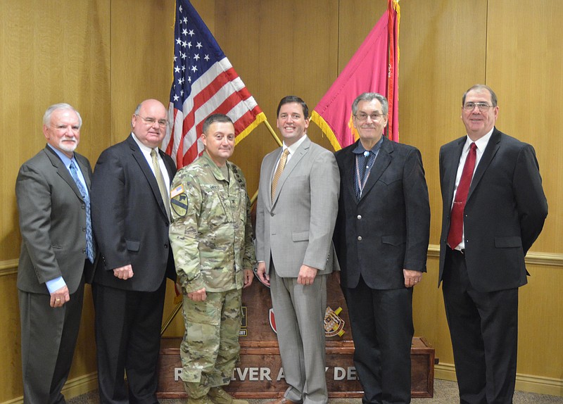 Red River Army Depot and BAE Systems signed a new teaming agreement Thursday. From left, Patton Tidwell, RRAD deputy commander; Bill Noonan, depot partnership manager; Col. Jason A. Carrico, RRAD commander; Andrew Corea, vice president for operations for combat vehicles; Gordon Jewett, site manager of operations; and Dave Isherwood, program manager for Bradley Vehicles. (Submitted photo)