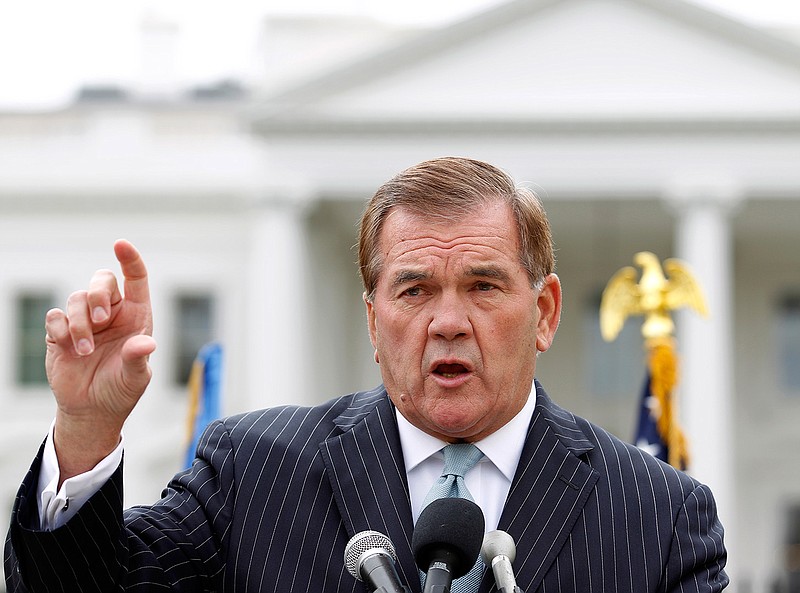 In this Oct. 22, 2011, file photo, former Secretary of Homeland Security Tom Ridge speaks to a crowd of hundreds protesting in front of the White House in Washington. A spokesman says Ridge is in critical condition after undergoing an emergency heart procedure at a hospital in Austin, Texas. 