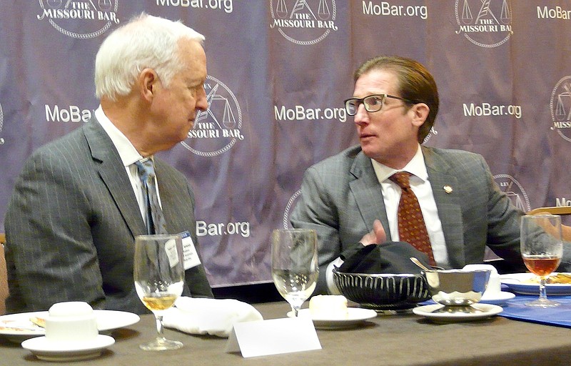 Supreme Court Judge W. Brent Powell, right, talks with Missouri Bar Vice President Thomas Bender, of Kansas City, following Powell's address to the Bar's Fall Conference luncheon at the Capitol Plaza Hotel.