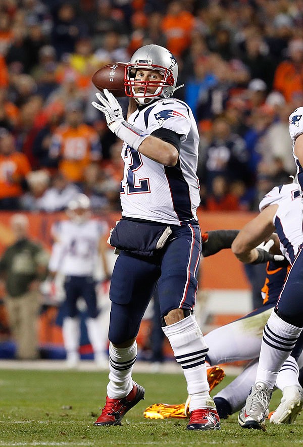  Patriots quarterback Tom Brady gets set to throw during last Sunday night's game against the Broncos in Denver.