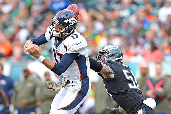 Eagles defensive end Chris Long causes Broncos quarterback Brock Osweiler to fumble during a Nov. 5 game in Philadelphia.