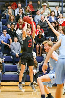 Ben Folz of Jefferson City goes up for a jump shot during a game against Father Tolton in Friday night's Jamboree at Rackers Fieldhouse.