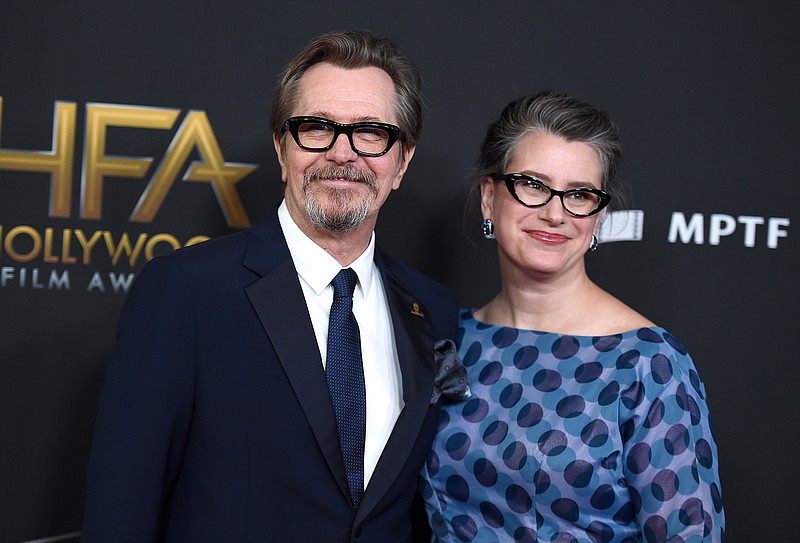  In this Nov. 5, 2017 file photo, Gary Oldman, left, and Gisele Schmidt arrive at the Hollywood Film Awards at the Beverly Hilton hotel in Beverly Hills, Calif. Oldman is married for the fifth time. The 59-year-old English actor wed art curator Schmidt in late August at the Beverly Hills home of his longtime friend and manager Doug Urbanksi, Urbanksi said Thursday, Nov. 9, 2017.