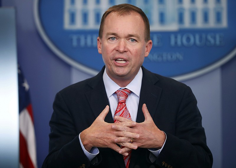 FILE - In this Thursday, July 20, 2017, file photo, Budget Director Mick Mulvaney gestures as he speaks during the daily press briefing at the White House in Washington. Mulvaney and Treasury Secretary Steven Mnuchin sent mixed signals Sunday, Nov. 19, on the fate of a health care provision in the Senate version of a $1.5 trillion measure to overhaul business and personal income taxes that is expected to be voted on after Thanksgiving. "I don't think anybody doubts where the White House is on repealing and replacing Obamacare. We absolutely want to do it," Mulvaney said. (AP Photo/Pablo Martinez Monsivais, File)