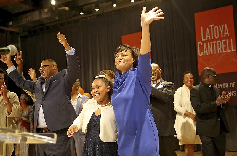 <p>AP</p><p>As her husband Jason Cantrell, left, cheers, LaToya Cantrell hugs her daughter RayAnn as she celebrates her victory in the New Orleans mayoral election during her election party at the New Orleans Jazz Market in Central City. She will be the first woman mayor in New Orleans’ history.</p>