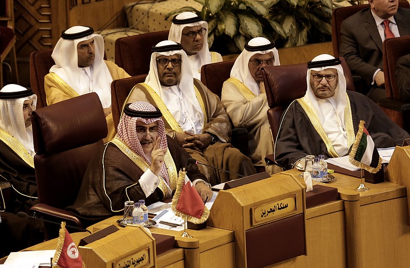 Bahraini Foreign Minister Khalid bin Ahmed al-Khalifa, left, speaks as Anwar Gargash, UAE Minister of State for Foreign Affairs, right, listens during a meeting at the Arab League headquarters in Cairo, Egypt, Sunday, Nov. 19, 2017. Saudi Arabia is asking fellow Arab nations to take a “serious and honest” stand against Iran, saying that showing leniency toward Tehran will only encourage it to press on with its “aggression“ and "meddling" in the internal affairs of Arab countries. (AP Photo/Nariman El-Mofty)