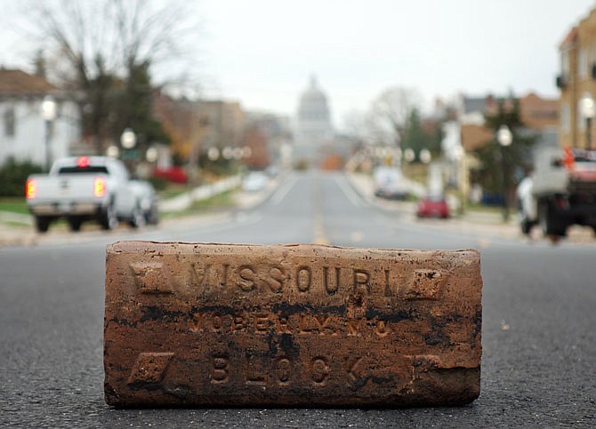 Old red bricks that once lined East Capitol Avenue were unearthed during the reach improvement project in the area. Though workers planned to reuse the bricks to fill a parking lot, Quinten Rice with Avenue HQ saved some of them and plans to incorporate them into his business to preserve their history in Jefferson City.