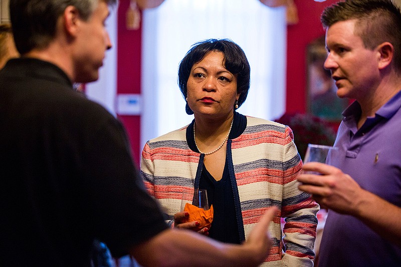 In this Sept. 22, 2017 file photo, New Orleans mayoral candidate LaToya Cantrell listens to donors at the home of Robert Ripley in New Orleans. On Saturday, Nov. 18, 2017, Cantrell and former municipal Judge Desiree Charbonnet were in a runoff that would determine which one would become the first woman elected to serve as New Orleans' mayor.