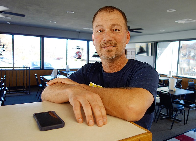 Chris Hilke poses at The Pizza Company, 1508 E. McCarty St., which is set to open Monday. Hilke and business partner Jason VanLoo bought the space in September. It previously housed J.C. Pizza Co., which closed June when its business license wasn't renewed. Though ownership and the name have changed a few times, the pies remain the same.