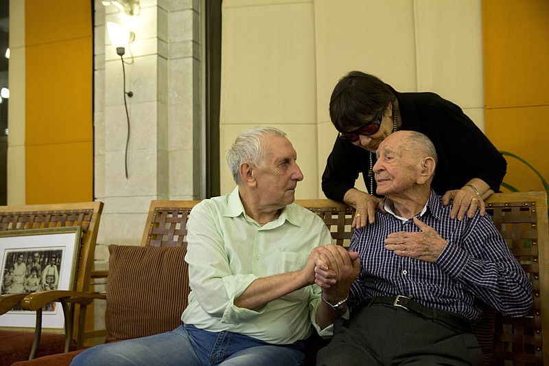 Associated Press
Israeli Holocaust survivor Eliahu Pietruszka, right, speaks with Alexandre Pietruszka on Thursday as they meet for the first time in the central Israeli city of Kfar Saba. Pietruszka, who fled Poland at the beginning of World War II and thought his entire family had perished, learned that a younger brother had also survived, and the brother's son, 66-year-old Alexandre, flew from Russia to see him.