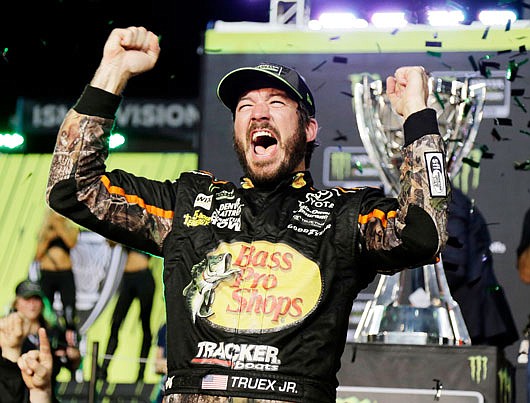 Martin Truex Jr. celebrates Sunday night after winning the NASCAR Cup Series race and season championship at Homestead-Miami Speedway in Homestead, Fla.