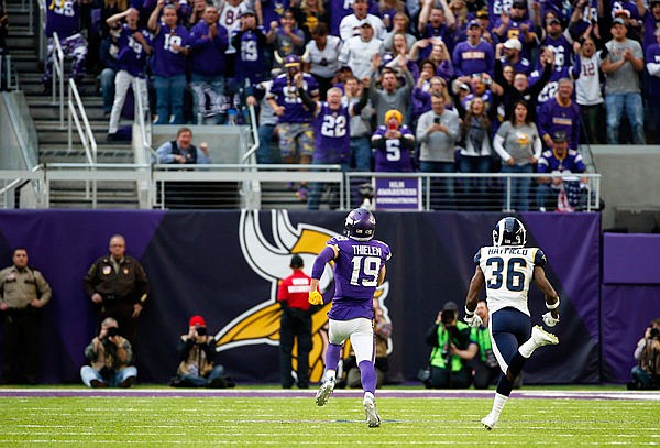 Vikings wide receiver Adam Thielen runs away from Rams defensive back Dominique Hatfield for a 65-yard touchdown last Sunday in Minneapolis.