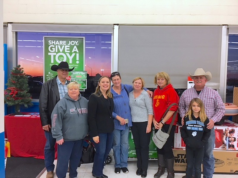 <p>Submitted photos</p><p>Moniteau County Toys for Tots volunteers selected $2,000-worth of toys, donated by the Toys-R-Us corporation.</p>