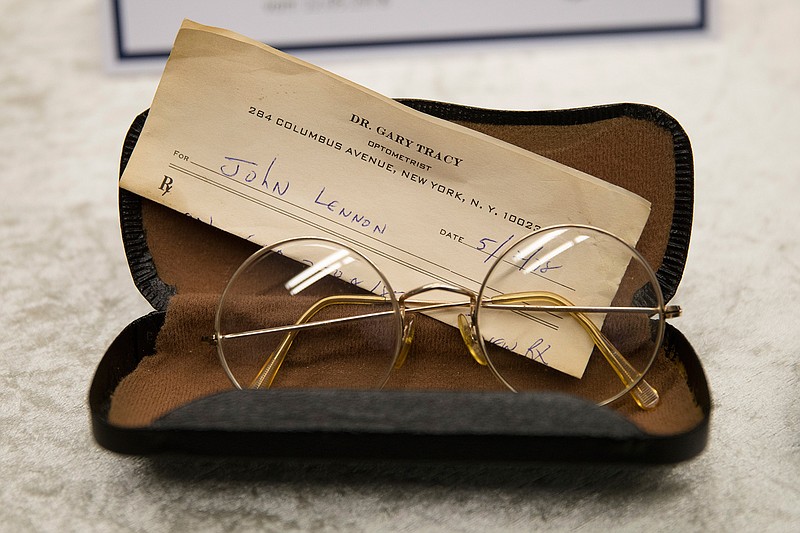 A pair of John Lennon's glasses with a prescription by optometrist Gary Tracy are displayed at the police headquarters in Berlin, Tuesday, Nov. 21, 2017, after German police arrested a man suspected of handling stolen objects from Lennon's estate, including diaries which were stolen from Lennon's widow, Yoko Ono, in New York in 2006. 