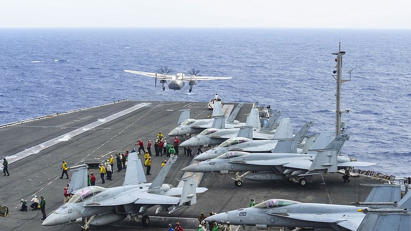  A C-2A Greyhound assigned to Fleet Logistics Support Squadron (VRC) 30 launches from the flight deck of the aircraft carrier USS Ronald Reagan (CVN 76) on Nov. 17, 2017. (Mass Communication Specialist 3rd Class Eduardo Otero/U.S. Navy via AP)