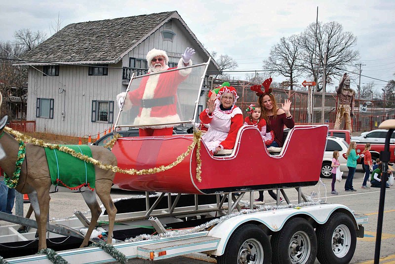 (Photo by Samantha Pogue) Santa, Mrs. Claus and his elves waved to hundreds of children in attendance at a past Lake of the Ozarks Christmas Parade in Lake Ozark. 