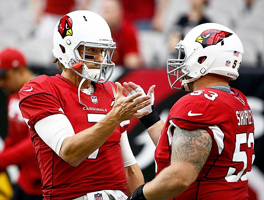 Cardinals quarterback Blaine Gabbert and center A.Q. Shipley warm up prior to Sunday's game against the Jaguars in Glendale, Ariz.