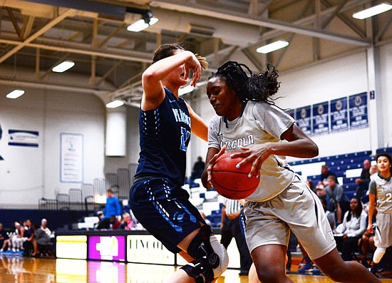 Bre Coleman of Lincoln makes a move toward the basket during Monday night's game against Upper Iowa at Jason Gym.
