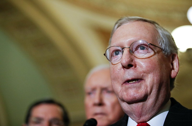 Senate Majority Leader Mitch McConnell of Ky., talks with the media after Senate Republicans met with President Donald Trump on Capitol Hill, Tuesday, Nov. 28, 2017, in Washington. (AP Photo/Alex Brandon)