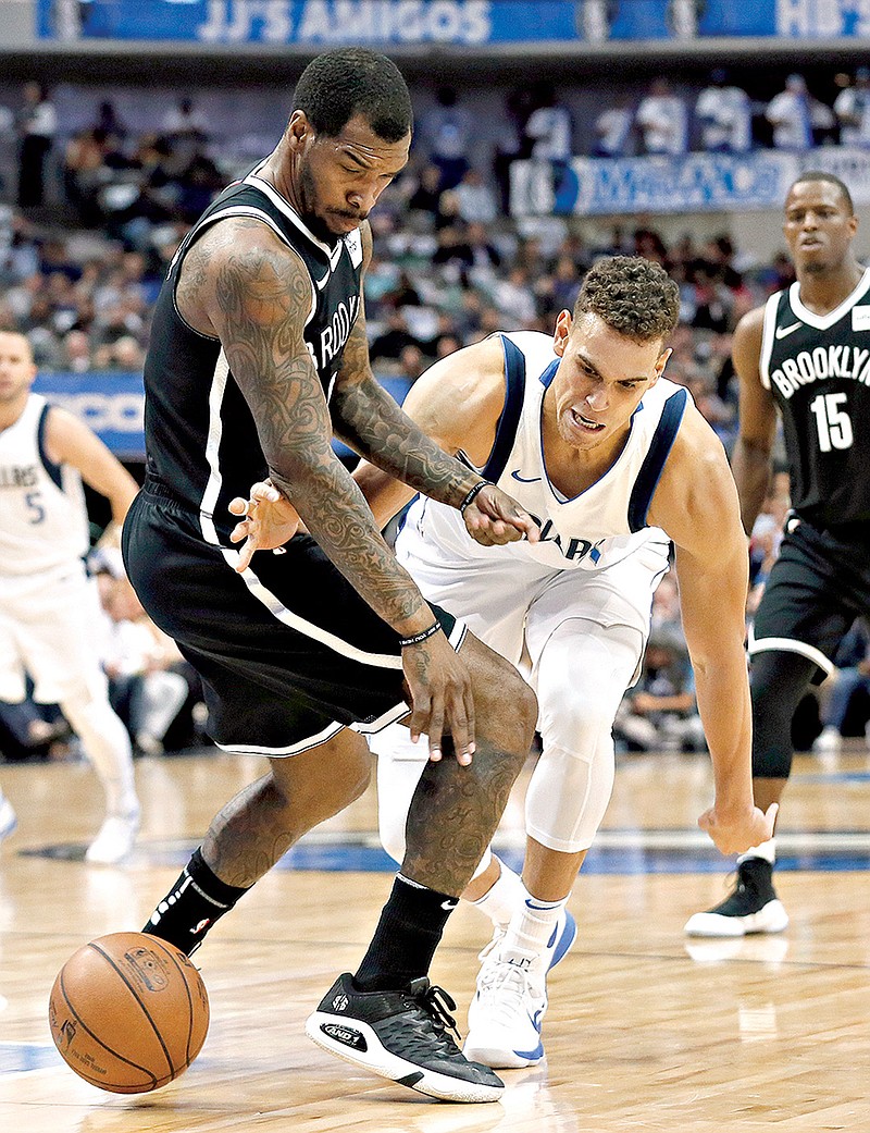 Brooklyn Nets' Sean Kilpatrick (6) strips the ball away from Dallas Mavericks forward Dwight Powell in the first half of an NBA basketball game, Wednesday, Nov. 29, 2017, in Dallas.