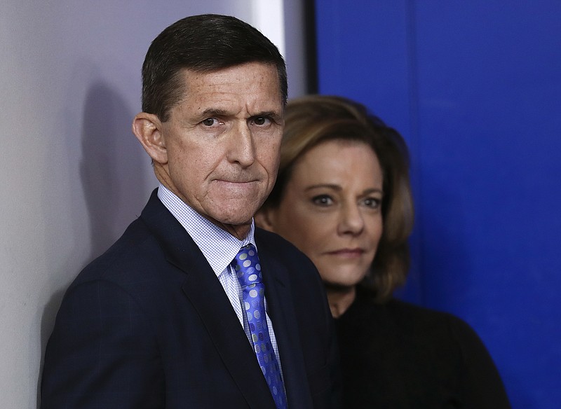 FILE - This Feb. 1, 2017, file photo shows then-National Security Adviser Michael Flynn, joined by K.T. McFarland, then-deputy national security adviser, during the daily news briefing at the White House, in Washington.  McFarland is an unnamed senior official referred to in the court papers filed in the Flynn case. She was involved in a discussion with Flynn about what he would say to Russian government officials in response to U.S. sanctions imposed on Russia last year. (AP Photo/Carolyn Kaster, File)
