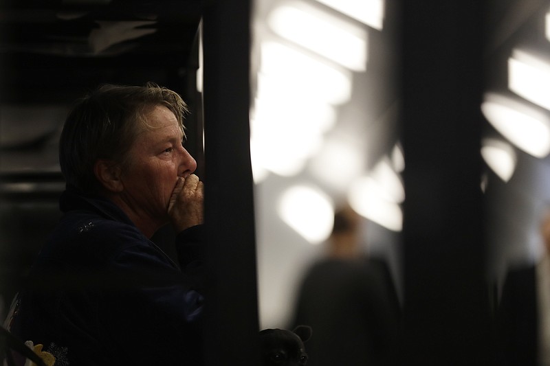 Verna Vasbinder looks on from her new bunk in the city's new Temporary Bridge Shelter for the homeless Friday, Dec. 1, 2017, in San Diego. The first of three shelters opened Friday, which will eventually provide beds for up to 700 people, as the city struggles to control a homeless crisis gripping the region. (AP Photo/Gregory Bull)