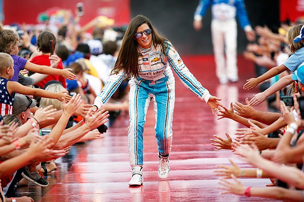 In this July 2, 2016, file photo, Danica Patrick greets fans during driver introductions before the start of the NASCAR Cup race at Daytona International Speedway in Daytona Beach, Fla.