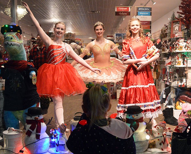 2017 FILE: Tayla Hughes, Marie Gillam and Sophia Schepers, of Dancers' Alley, perform scenes from the Nutcracker in the window of Carrie's Hallmark Shop downtown. 
