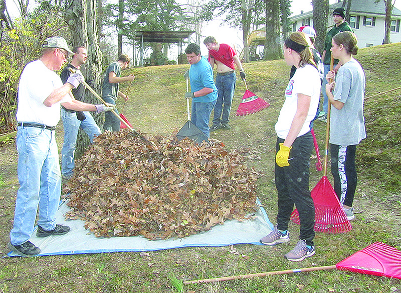 Operation Leaf Relief volunteers rake leaves Dec. 3, 2017, at 921 Winston Drive. It was the last day of raking for the 2017 fundraiser benefiting Operation Bugle Boy and a memorial for the late Lorraine Adkins, a longtime veterans supporter.