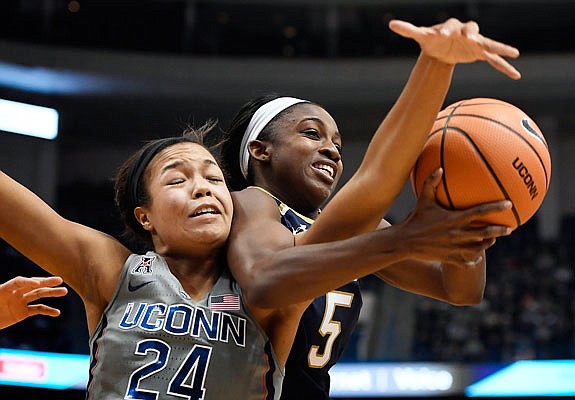 Connecticut's Napheesa Collier tangles with Notre Dame's Jackie Young as they reach for a rebound during Sunday's game in Hartford, Conn. Collier, a former Jefferson City Lady Jay, finished with 15 points and nine rebounds in UConn's 80-71 victory.