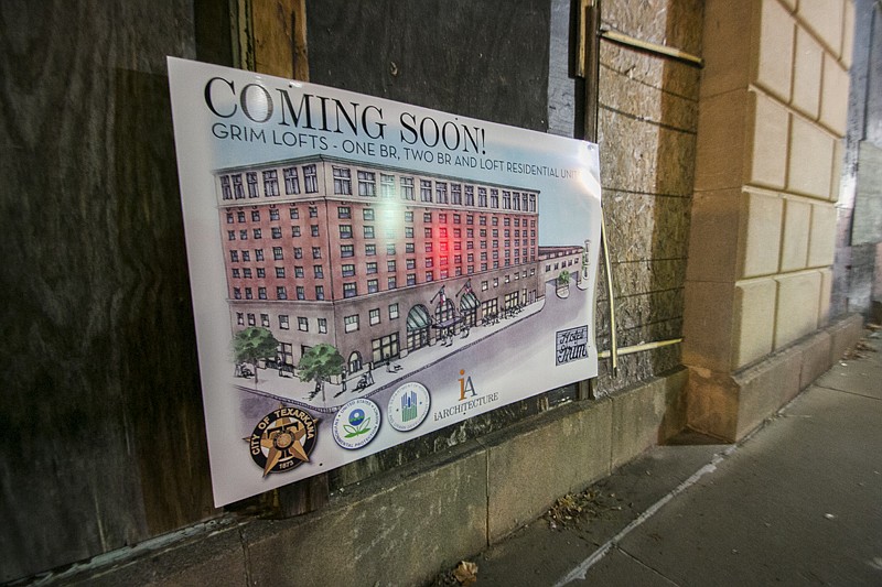A new sign has been put up on a wall of the Grim Hotel advertising the developer's plans for the building.