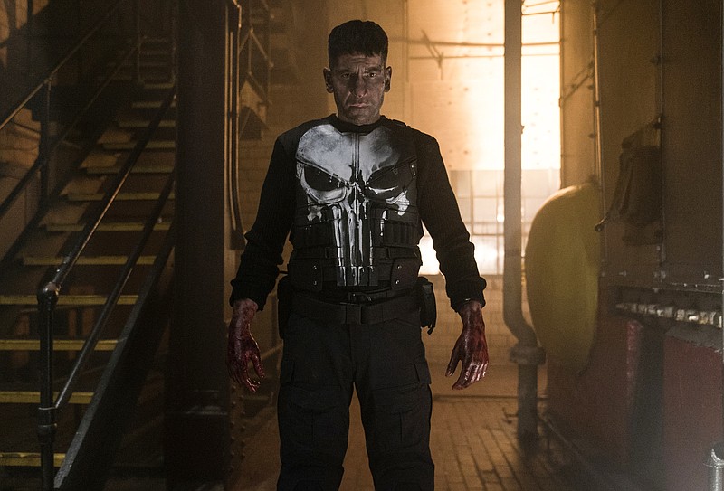 This image released by Netflix shows Jon Bernthal as Frank Castle in "Marvel's The Punisher," one of the many series based on comic books, currently streaming on Netflix. (Jessica Miglio/Netflix via AP)