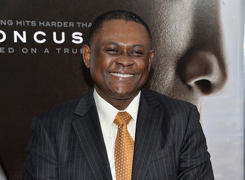 FILE - In this Dec. 16, 2015 file photo, Dr. Bennet Omalu attends a special screening of "Concussion" in New York. Omalu, a pathologist best known for researching NFL brain injuries, resigned Tuesday, Dec. 5, 2017, from the San Joaquin County coroner's office accusing Sheriff-Coroner Steve Moore of interfering with death investigations to protect law enforcement officers.  (Photo by Evan Agostini/Invision/AP, File)