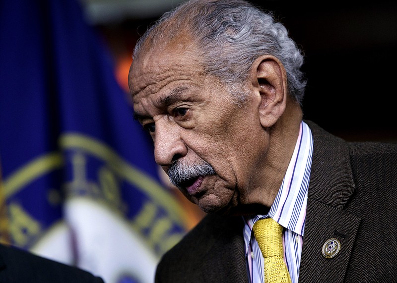 FILE -- In this file photo from Feb. 14, 2017, Rep. John Conyers, D-Mich., attends a news conference on Capitol Hill in Washington. Besieged by allegations of sexual harassment, Conyers resigned from Congress on Tuesday, Dec. 5, 2017, bringing an abrupt end to the civil rights leader's nearly 53-year career on Capitol Hill. (AP Photo/J. Scott Applewhite, file)