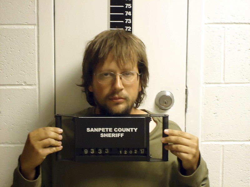 This undated photo provided by Sanpete County Jail shows John Coltharp. Police say Utah men Coltharp and Samuel Shaffer are under arrest after a search near a remote, makeshift compound turned up two girls taken by their father, Coltharp, to join an upstart sect relatives say is based around polygamy and doomsday. Iron County Sheriff's Lt. Del Schlosser said Tuesday, Dec. 5, 2017, the girls aged 4 and 8 were found cold but uninjured after deputies combed the desert near the makeshift compound made of storage containers on Monday. (Sanpete County Jail via AP)