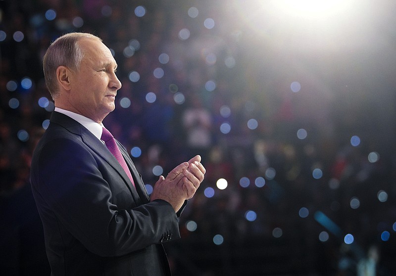 Russian President Vladimir Putin attends the annual Volunteer of Russia 2017 award ceremony at the Megasport Sport Palace in Moscow, Russia, Wednesday, Dec. 6, 2017. Putin has moved an inch closer to announcing his intention to seek re-election in the next March's vote, saying he would weigh the move based on public support.(Alexei Druzhinin, Sputnik, Kremlin Pool Photo via AP)