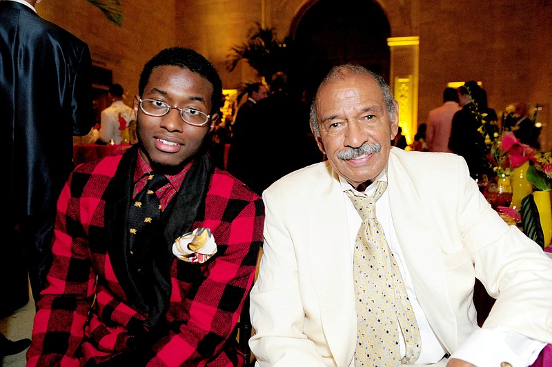 In this July 16, 2011 photo, John Conyers, III poses with his father Rep. John Conyers, D-Mich., in Detroit. John Conyers' resignation from the U.S. House amid sexual harassment allegations unlocks the seat he's held for more than a half-century. The 88-year-old endorsed his son, political neophyte John Conyers III. (Ricardo Thomas /Detroit News via AP)