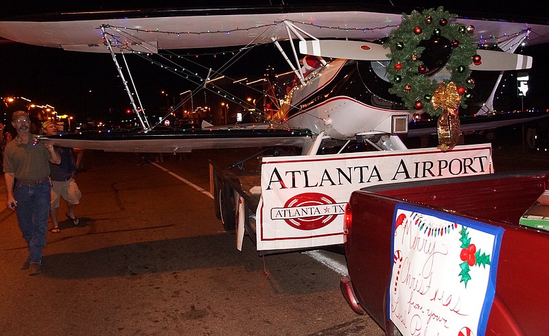 The appearance of Tevis Pappas's 1971, two-seat experimental biplane is a first for Atlanta's Christmas parade. 