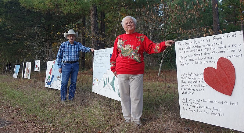  Community member Jerry Caver helped Oreta Wright put up Christmas decorations as well as her Grinch signs at the village of Kildare, Texas.