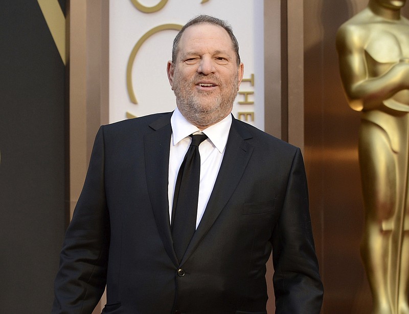 FILE - In this March 2, 2014 file photo, Harvey Weinstein arrives at the Oscars in Los Angeles. Even though the former Weinstein Co. co-chairman has been kicked out of the Academy of Motion Pictures Arts and Sciences and his company’s name has been erased from its best Oscar shot this year (“Wind River”), Weinstein will be ubiquitous in absentia. The ongoing sexual harassment scandals have colored every phase of awards season so far. But whether they will ultimately shape who wins is another question. (Photo by Jordan Strauss/Invision/AP, File)