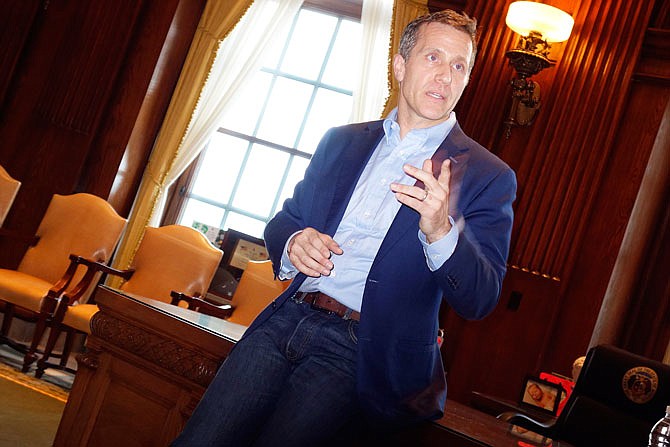 Gov. Eric Greitens speaks Wednesday afternoon during a private meeting with rural newspaper reporters in his office.