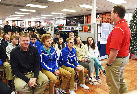 Jefferson City High School boys coach Mark Anderson introduces his players (standing in back) Wednesday for the upcoming holiday basketball events.