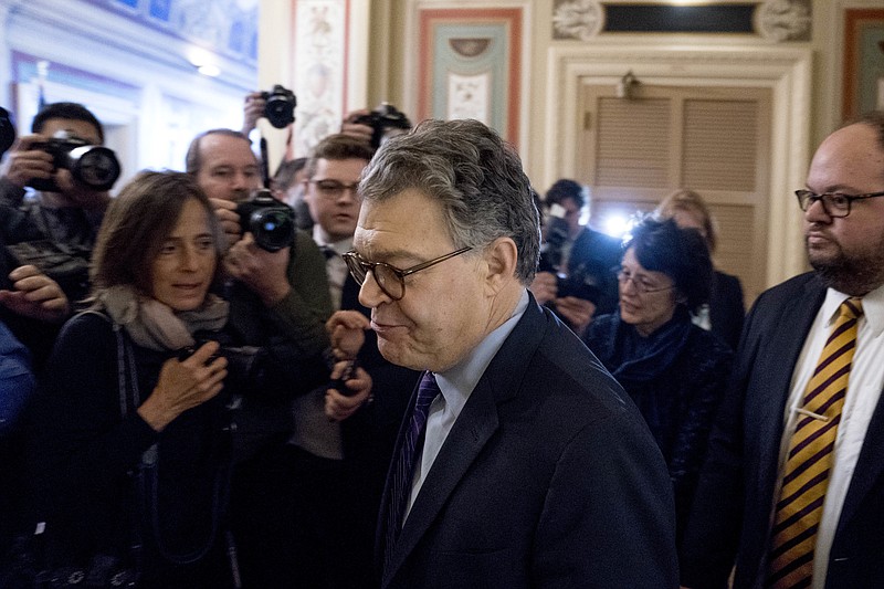 Sen. Al Franken, D-Minn., arrives on Capitol Hill in Washington, Thursday morning, Dec. 7, 2017. Franken said he will resign from the Senate in coming weeks following a wave of sexual misconduct allegations and a collapse of support from his Democratic colleagues, a swift political fall for a once-rising Democratic star. (AP Photo/Andrew Harnik)