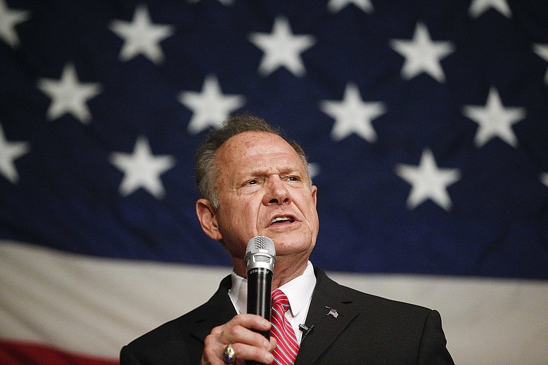 In this Dec. 5, 2017, photo, former Alabama Chief Justice and U.S. Senate candidate Roy Moore speaks at a campaign rally in Fairhope Ala. Moore has ignored all the rules of modern-day politics. But on the ground in Alabama, some believe the Republican Senate candidate is poised to win the state’s special election on Tuesday in a race that features extraordinary parallels with President Donald Trump’s White House run one year ago. (AP Photo/Brynn Anderson)