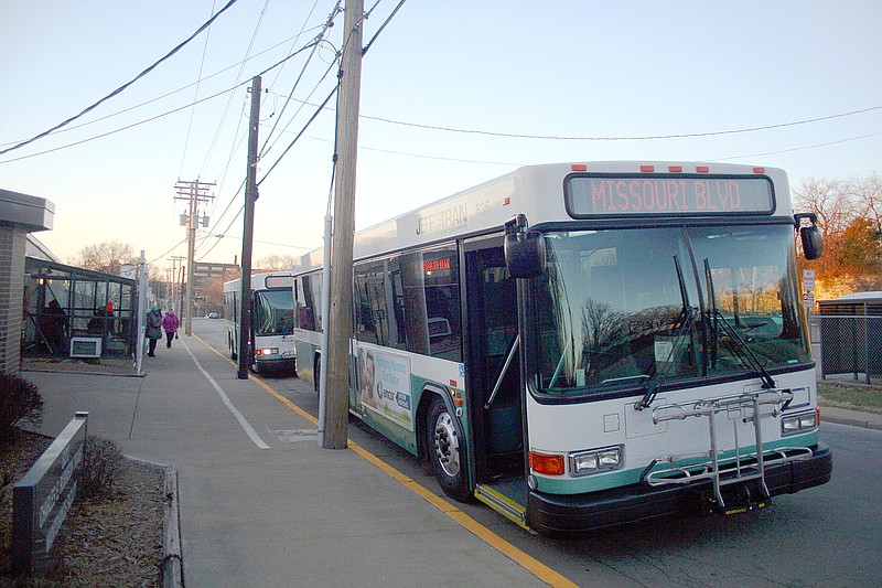 FILE: A JeffTran bus waits for passengers to board at a bus stop at 820 E. Miller St.