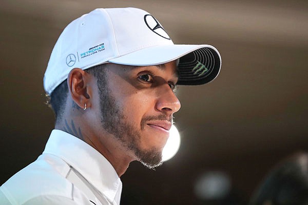 In this Nov. 29 file photo, Formula One driver Lewis Hamilton listens to a question from the media during a celebratory event by Petronas in Kuala Lumpur, Malaysia. Hamilton scored points in all Formula One races this season.